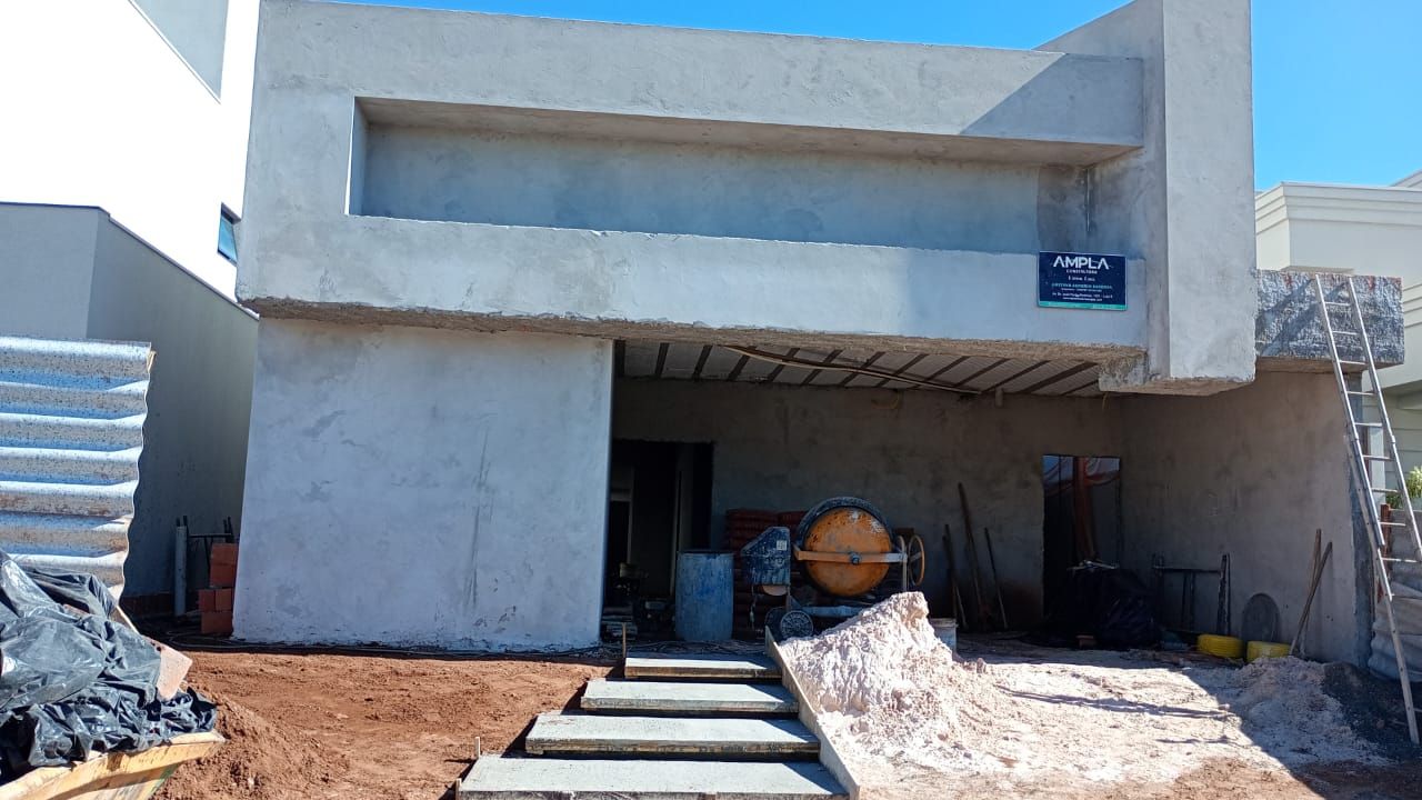 Vista frontal da obra com garagem e acesso